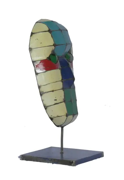 Product image of the product “Small Mask on stand - Modell 4, 53cm height, sculpture from upcyceled oil barrel. ”